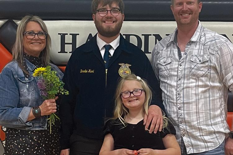 KRISTY MCBEE (left) is supported by her family as she helps students succeed at Hardin-Central High School. Submitted