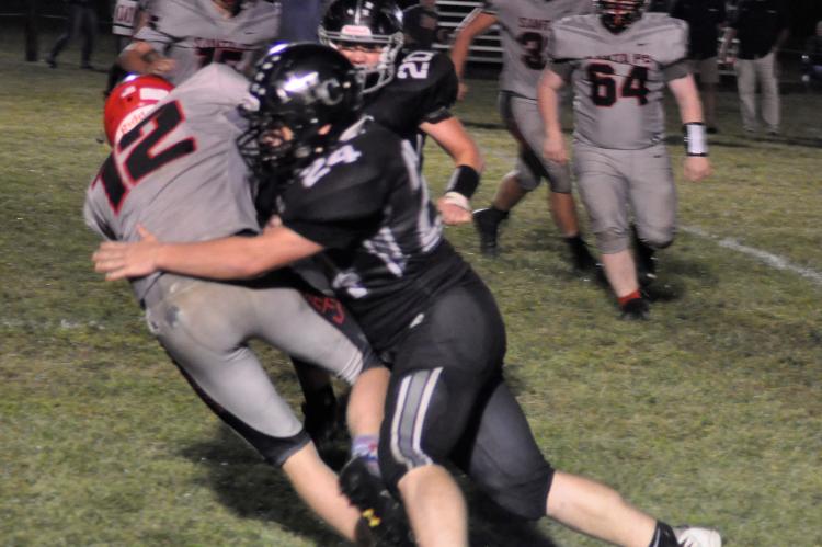 Driving him into the turf