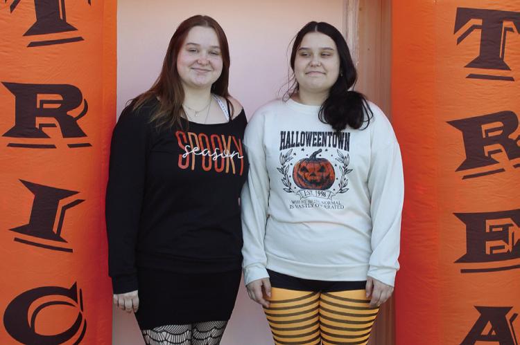 LILLIAN (LEFT) AND Kandence Quick welcome visitors to the haunted house at the Hardin Police Station. SHARON DONAT | Staff
