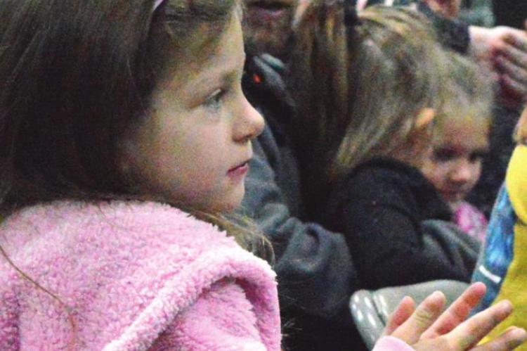 CLAPPING for the puppet show, Josie Riche sports pink bunny ears for the Easter event at the Eagleton Center. TARA ALTIS | Staff