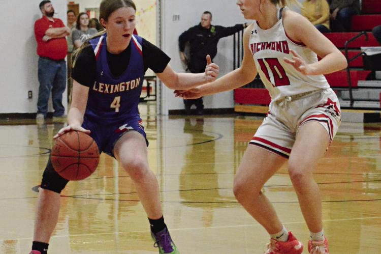 RICHMOND CONTINUES to utilize man-to-man defense, as Kaylee Pugh shows by guarding Lexington’s Zoey Earnest Feb. 9 at Richmond. SHAWN RONEY | Staff