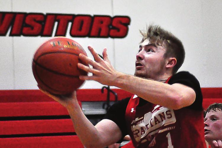SPENCER WOLF, one of two seniors in the gym when boys basketball practices start in November because of Richmond’s Class 2 state semifinal run in 11-man football, goes for a layup Nov. 22. SHAWN RONEY | Staff