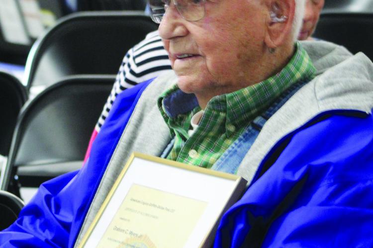 GRAHAM C. MYERS JR., 98, accepts recognition from American Legion Post 237 as Ray County’s oldest living World War II veteran. SHARON DONAT | Staff