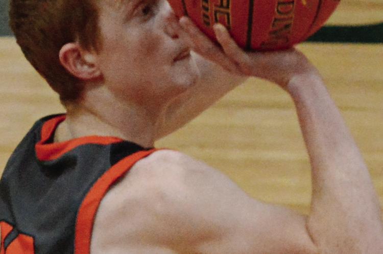 HARDIN-CENTRAL junior Kaden McGinnis attempts a free throw during the Bulldogs’ season opener with Polo.