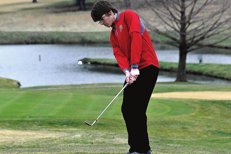 RICHMOND JUNIOR Aiden Bowman, one of seven returning boys golfers for the Spartans, practices his chip shot March 16 at Shirkey Golf Course. SHAWN RONEY | Staff
