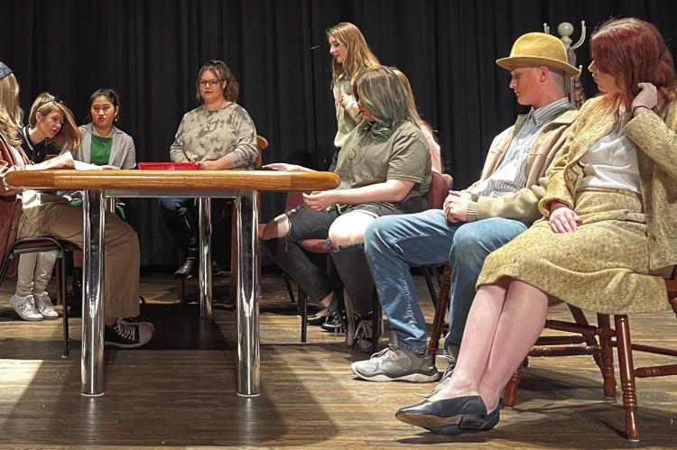 FROM LEFT, MARLIE MCADAMS, JAZLIN JAMESON, Raigan Braley, Aspen Erskine, Hannah Hayes, Eve Tompkins, Jazspher Ulleberg and Rori Linder rehearse while in character. Ulleberg says he would love it if the community would come out to show its support for the comedic play.
