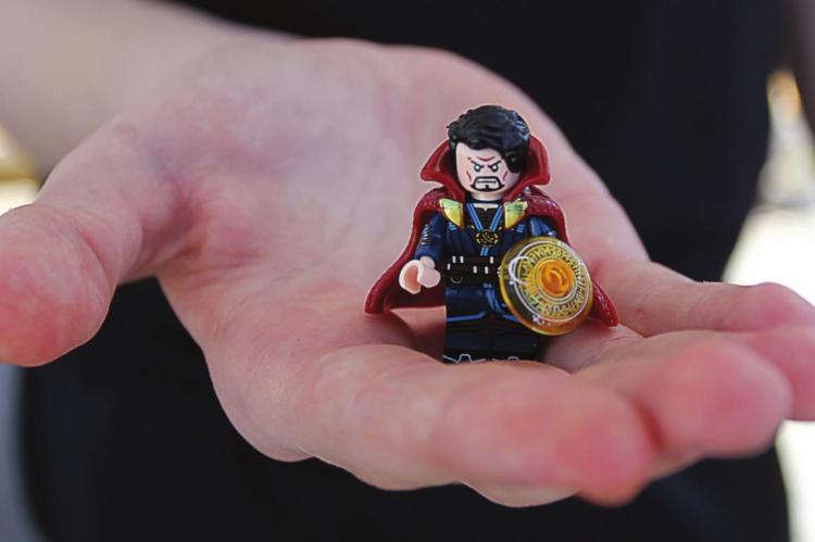 THIS CLOSEUP reveals details in Aidan Leroy’s Lego-compatible version of Dr. Strange, including mystical runes in the orange shield and the cape that climbs up to his ears and has been known to pet his face.