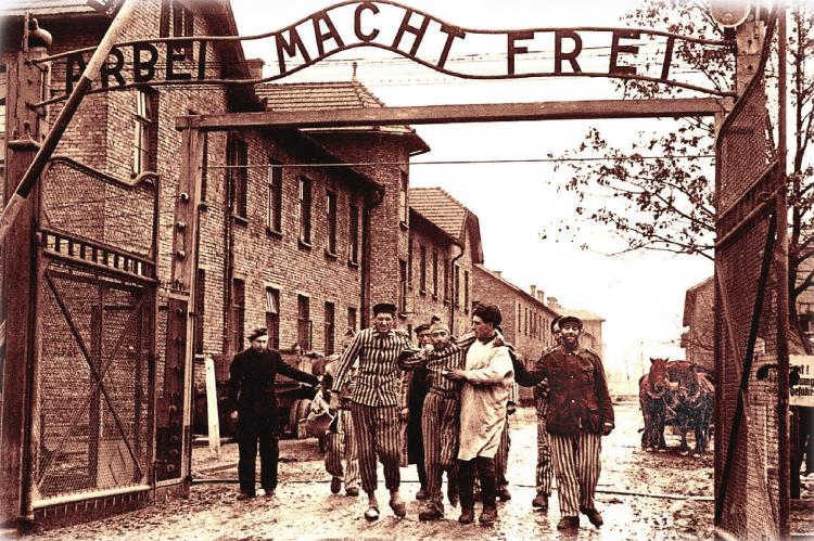 SOVIET SOLDIERS liberate the Nazi death camp at Auschwitz in January 1945, a few months before World War II ends. Over the camp gates are the words, “Arbeit Macht Frei,” meaning “Work Sets You Free.” The meaning is ironic and cruel, because being worked to death is the only way thousands of camp prisoners became free. An exhibition at Union Station covers the story of Auschwitz.