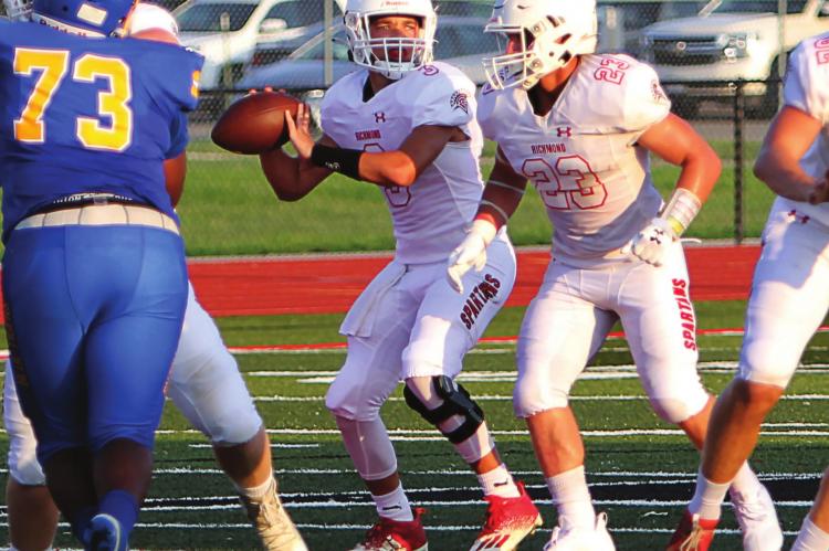 AT THE JAMBOREE in Odessa – a three-way practice session among Richmond, Odessa and Lincoln College Preparatroy Academy – Richmond senior quarterback Keyshaun Elliott drops back to pass.