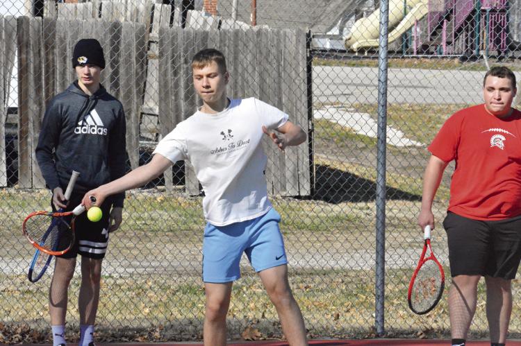 RICHMOND TENNIS COACH Brett Terry plans for his Spartans, some of whom are seen here practicing in mid-March at Southview Park, to play some “challenge matches” as they prep for their April 11 road dual with Carrollton. SHAWN RONEY | Staff