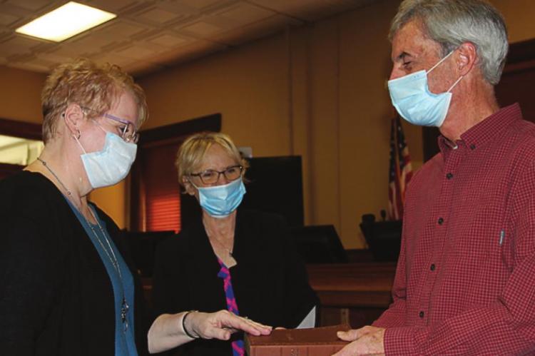 LINDA COLEMAN takes the oath of office as assessor.