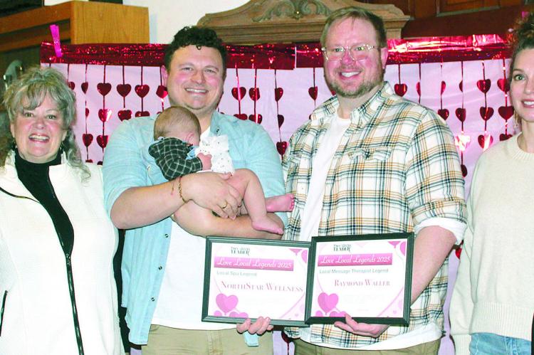 NORTHSTAR WELLNESS owner Raymond Waller (third from right) is joined by family and friends after the business is named Best Spa and Waller is recognized as Best Massage Therapist, during the annual Love Local Legends ceremony. MIRANDA JAMISON | Staff