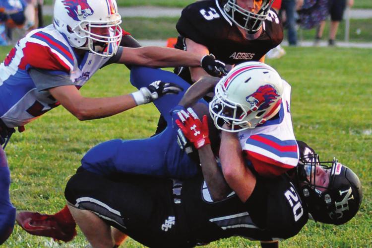 JUNIOR PEYTON MEIERER, No. 20, makes a first-half tackle for the Aggies during their Week 1 meeting at Hardin-Central with Kansas City East Christian, a Kansas-based program consisting of homeschooled students. SHAWN RONEY | Staff