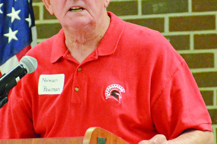 RICHMOND HIGH SCHOOL alumnus Norman Bowman mixes levity, stats and seriousness as he inducts the 1962 varsity football team recently into the Richmond High School Athletic Hall of Fame. SHAWN RONEY | Staff