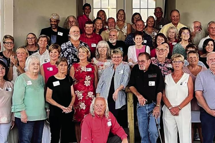 ALUMNI OF RICHMOND High School’s 1974 graduating class convene at Shirkey Golf Course to celebrate their momentous 50th class reunion. Amidst the festivities, the class members come together to proudly present a generous $1,000 check to the Richmond Educational Foundation. NANCY JONES | Submitted