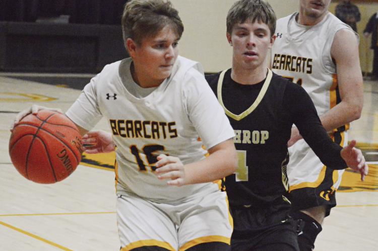 FRESHMAN LANDON SMITH (left) gets some game experience during Orrick’s non-conference clash with Lathrop in varsity boys basketball. SHAWN RONEY | Staff