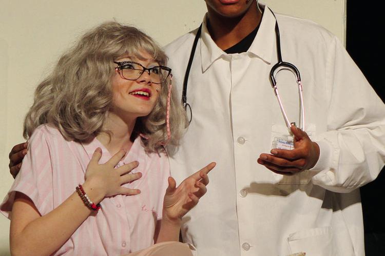 KALIE HENDRIX (left) is poisoned by the doctor, played by Zavier Davis, in a twisted soap opera plot.