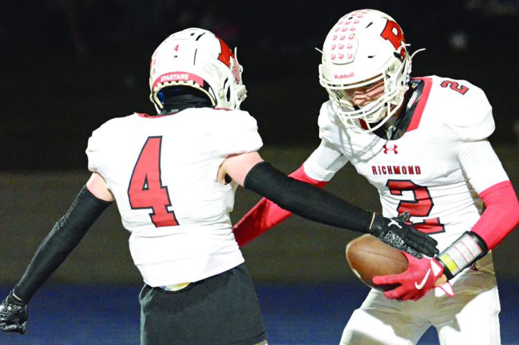 RICHMOND SENIOR Bryer Farnan (right), shown celebrating with Nolan Quick after a touchdown, is taking his game to Central Methodist University. SHAWN RONEY | Staff