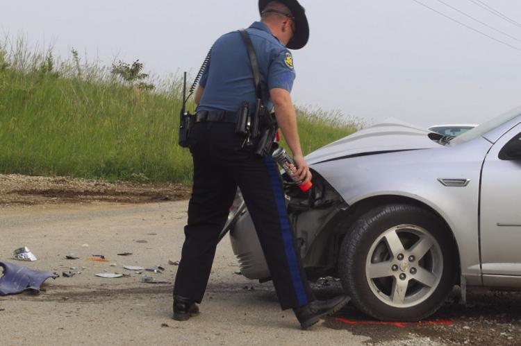 Sergeant D. Kline, MSHP, conducts accident investigation. MIRANDA JAMISON | Staff