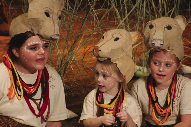 LIONESSES ISABELLA HENDELEY (from left), Gray McBee and Addison Garland sit on stage during the first scenes of the Farris Youth Theatre Company’s musical performance. Read story on page 5, see more photos on page 16. SOPHIA BALES | Staff