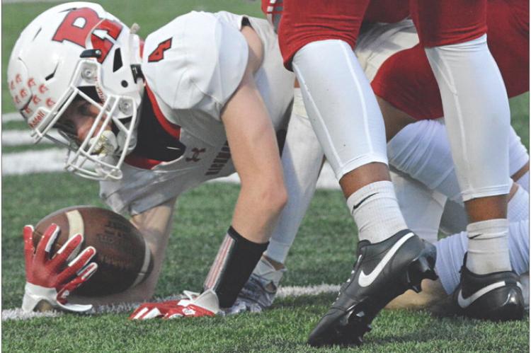 SOPHOMORE NOLAN QUICK stretches out when he’s tackled after a short gain on a first-half pass play during Richmond’s Sept. 15 varsity football clash with Van Horn, an Independence-based school. Van Horn, playing at home, goes on to defeat the Spartans 29-12. SHAWN RONEY | Staff