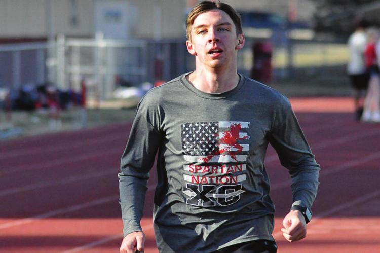 RICHMOND SENIOR Jude Rumbaugh trains March 5 on the high school track, looking to “try to get back into the feel of running again.” SHAWN RONEY | Staff