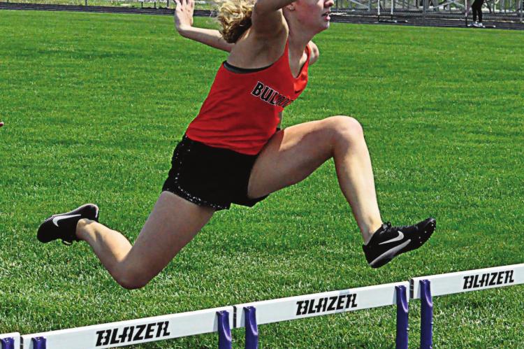 GRACIE GIBSON of Hardin-Central sails through the air late in the girls 300-meter low hurdles May 8 during Class 1 District 7 competition. Gibson finishes second to qualify for sectionals. SHAWN RONEY | Staff