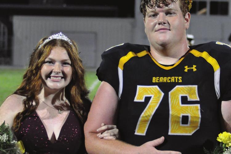 SAVANNAH BARTLEY and Ross Greer are crowned homecoming queen and king Sept. 17 during halftime of the Orrick High School football team’s 90-58 victory over Braymer/Breckenridge, a win coach Kirk Thacker considers the Bearcats fortunate to secure. SHAWN RONEY | Staff