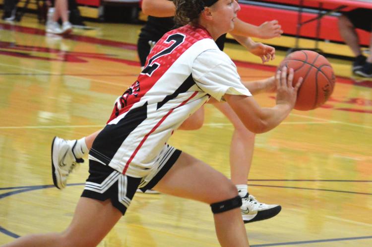 SYDNEY APPLEBERRY looks to pass as the Spartans push the ball down the court June 30 during some offseason scrimmaging with Braymer at Richmond High School. SHAWN RONEY | Staff