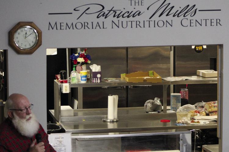 BRYAN COUCH PRESENTS the new Patricia Mills Memorial Nutrition Center during the dedication ceremony. SHARON DONAT | Staff