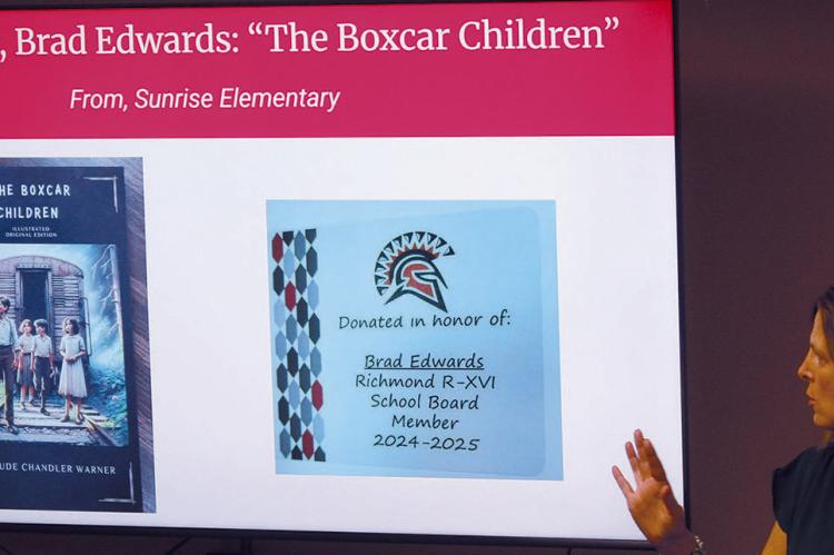 SUNRISE ELEMENTARY Principal Sara Terrill thanks the school board members with a book donated in each of their names to the Sunrise library. SHARON DONAT | Staff