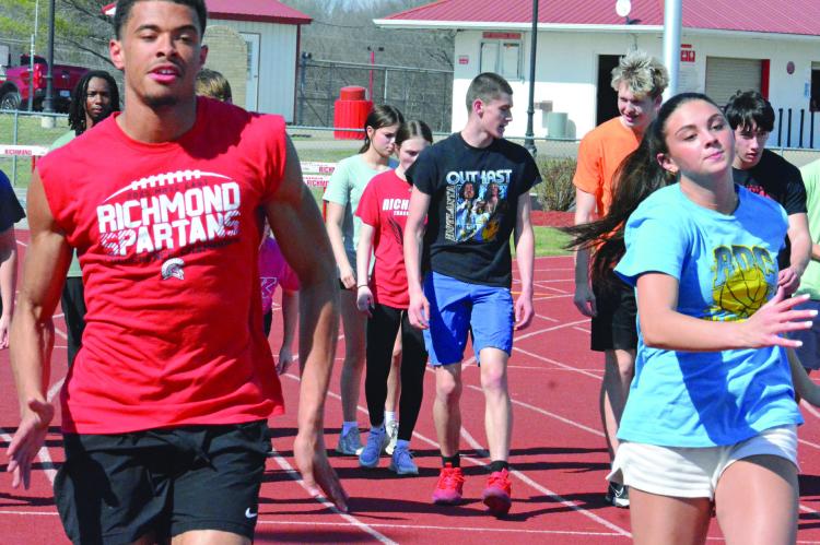 BRICE DOME (left), shown warming up at practice with Emma Hash, is among three returning state qualifiers for Richmond in track and field. Dome placed seventh in the triple jump at the 2025 Class 3 state meet. SHAWN RONEY | Staff