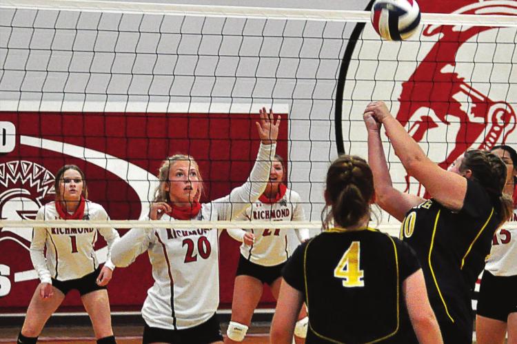 SHAWN RONEY | Staff LANEY MOYER, No. 20, is ready to go up to attempt a block for the Spartans, if necessary, as the Bearcats attempt to get the ball over the net during a Sept. 10 meeting at Richmond.