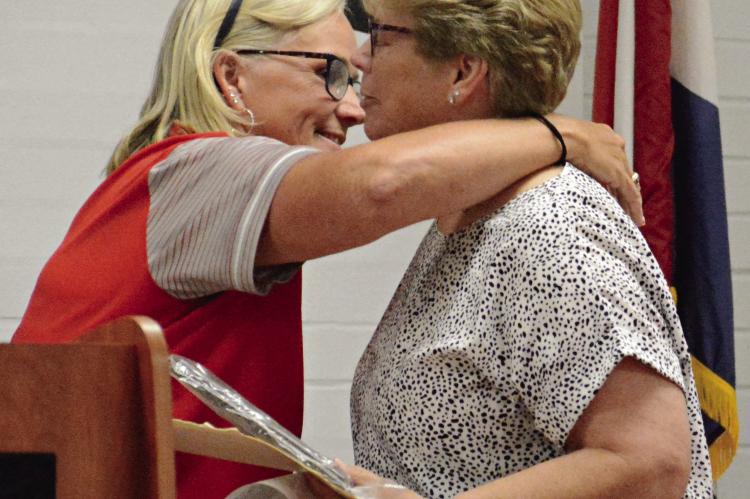STACI MADDUX (left) embraces Miss Ethel Kirkpatrick Spartan Spirit Award recipient Jayanna Harrison. SHAWN RONEY | Staff