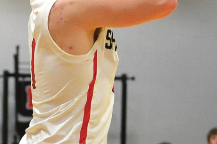 SPENCER WOLF attempts a first-half jumper Tuesday night.