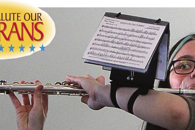 RICHMOND High School Band member Savanna Ray performs for Veterans Day at the Ray County Courthouse. Her flute includes a mouth guard to help prevent the spread of COVID-19. More pictures on pages 10-11.