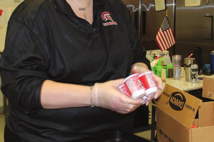 NUTRITION Enrichment Director Tracy Sanchez breaks out the yogurt.