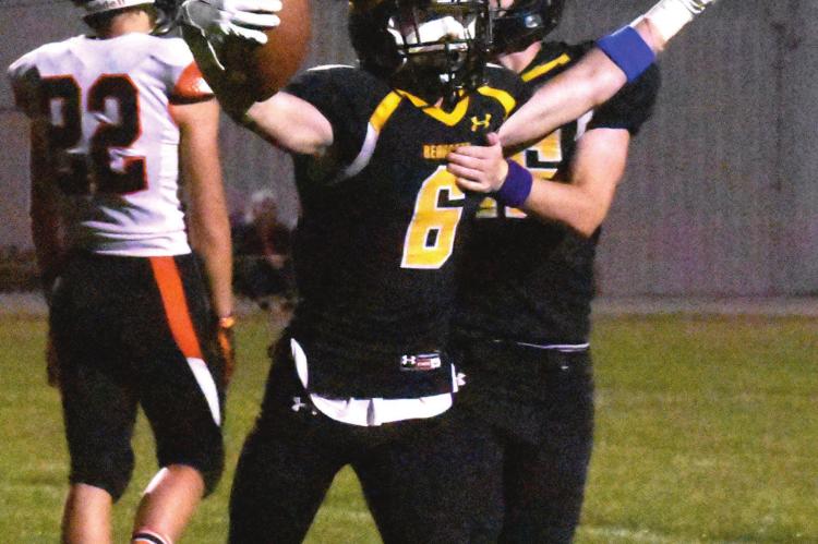 FOOTBALL FIRMLY in hand, Orrick senior Blake Buchanan has reason to cheer, as he and his fellow Bearcats contain Northwest/Sacred Heart’s passing attack and roll to a 68-26 Sept. 24 home victory. TARA ALTIS | Staff affiliate