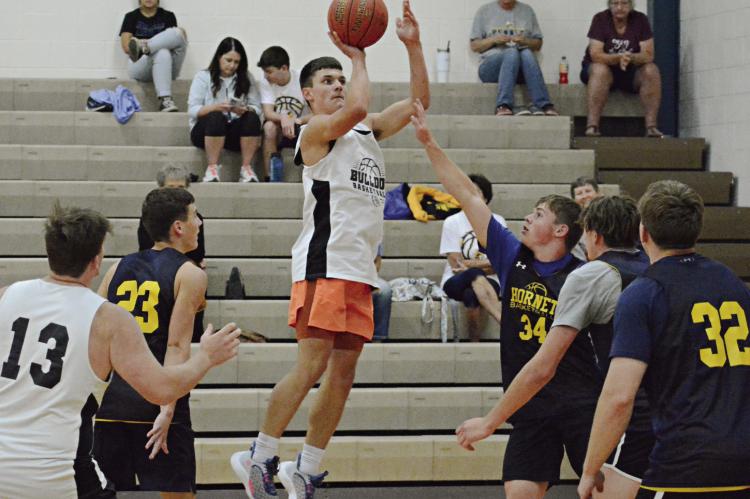 KAMERON PUGH attempts a jump shot during Hardin-Central’s meeting with Penney of Hamilton Monday in summer-league play at Lawson. SHAWN RONEY | Staff