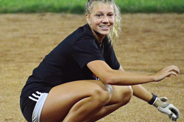 KAYLEE PUGH beams as she leads the Spartans through their stretches Monday morning at Southview Park. SHAWN RONEY | Staff