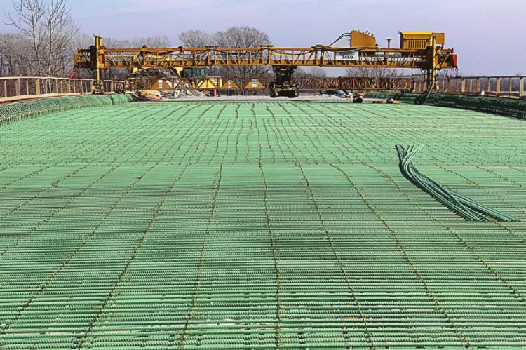 CONCRETE is poured into place on the Route J Bridge in southern Ray County. J.C. VENTIMIGLIA | Staff