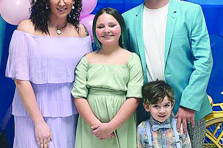 SAMANTHA WALKER, ADAILYN CARTER, Deven and Colson Walker enjoy their evening at the Sunrise Elementary dance. SAMANTHA WALKER | Submitted