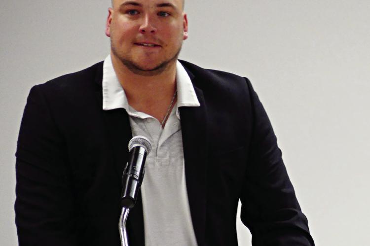 QUINTON MAXWELL rocks a jacket and polo shirt as part of his induction wardrobe.