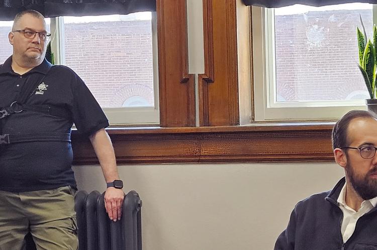RAY COUNTY SHERIFF’S OFFICE Sergeant David Francken (left) and Victory Technology Owner Evan Allen review equipment costs, installation details and monitoring access during a discussion about proposed camera systems for county facilities. MIRANDA JAMISON | Staff