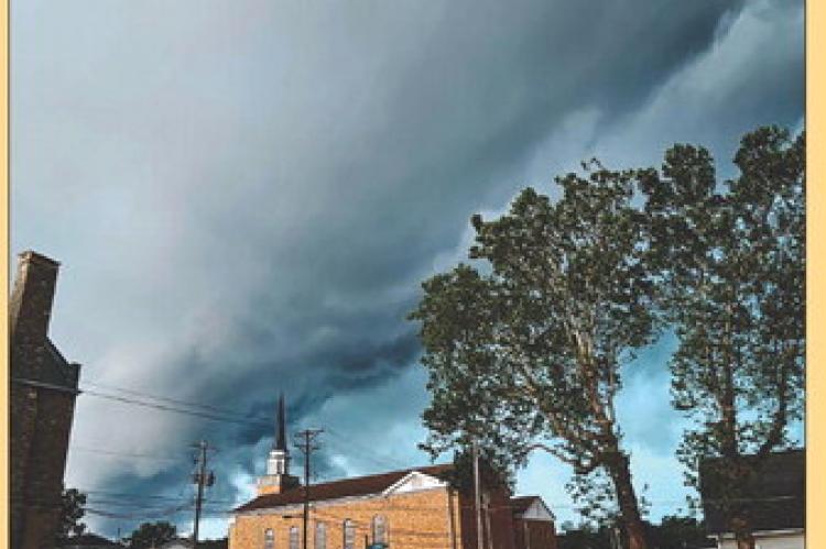 DARK CLOUDS LOOM over Ray County as stormy skies signal the approach of peak tornado season. Pictured above is the tense calm just moments before tornado sirens began to sound, following confirmed tornado sightings in the Kansas City area. MIRANDA JAMISON | Staff