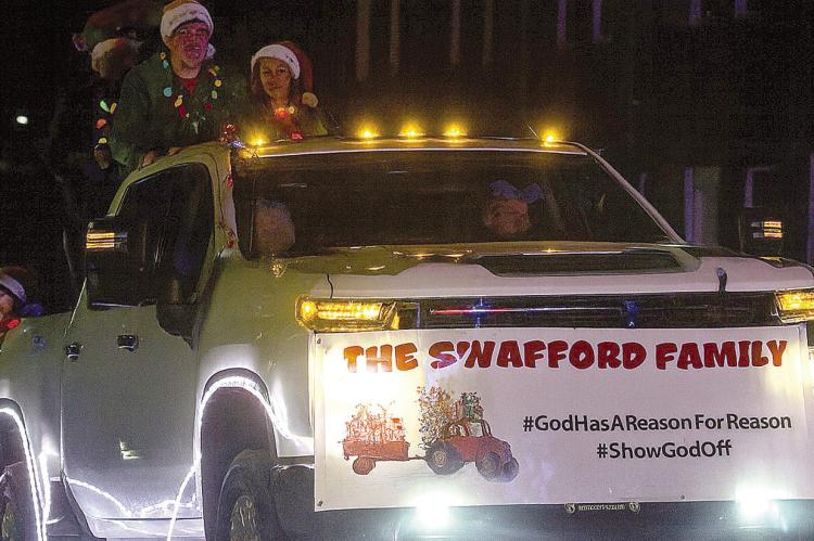 GRAND MARSHAL REASON SWAFFORD and family travels the parade route. SHARON DONAT | Staff