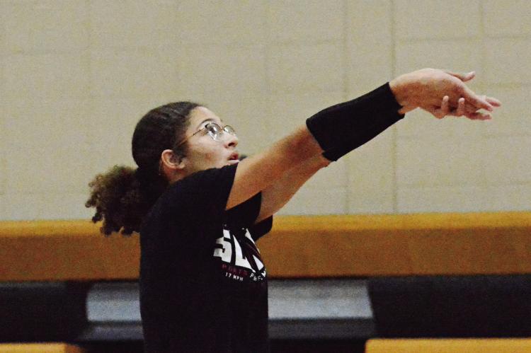 JUNIOR ANELA FLETCHER works on her bump passing during an Aug. 10 Orrick volleyball practice session in the Orrick High School gym. SHAWN RONEY | Staff