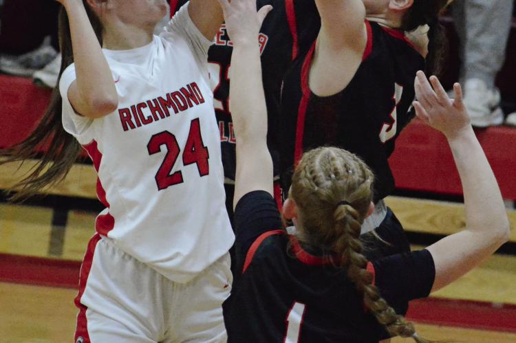 BRYLEE CASTILLEJA (left) attempts a contested shot during the Spartans’ meeting with Odessa in the girls title game at the Richmond Winter Classic. SHAWN RONEY | Staff