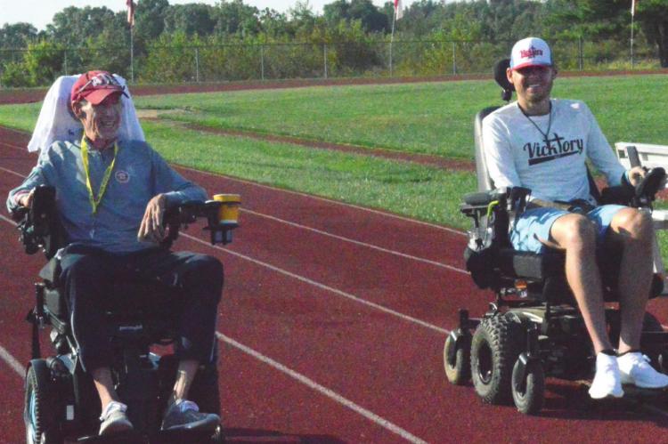 RACING around the track, Mark Johnson and Tony Vick jam out to Free’s “All Right Now.” TARA ALTIS | Staff