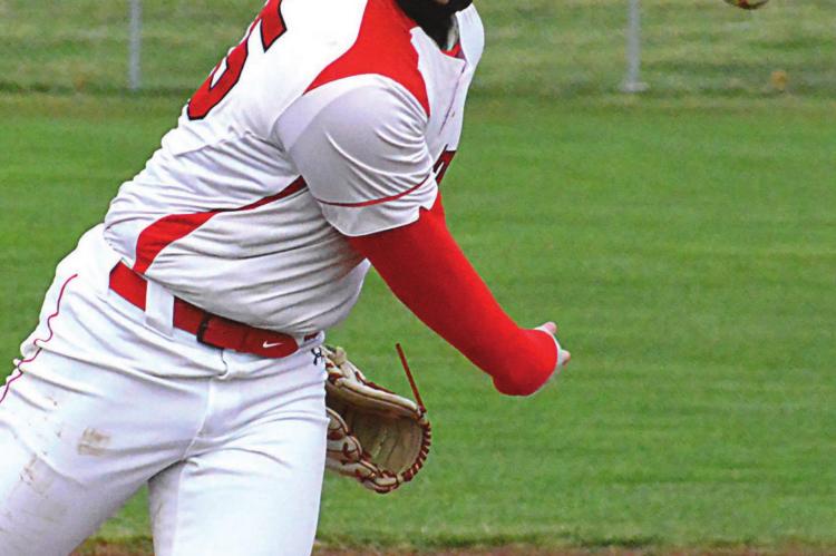 RICHMOND SENIOR Lucas Rodenberg watches his pitch sizzle April 7 against St. Joseph Benton at Southview Park. SHAWN RONEY | Staff